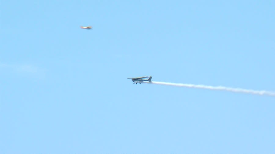 Two planes fly over Lakeland Linder Int’l Airport during Sun ‘n Fun Wednesday