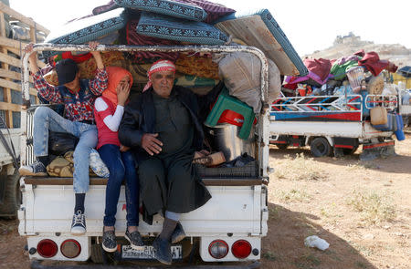 FILE PHOTO: Syrian refugees prepare to return to Syria from the Lebanese border town of Arsal, Lebanon June 28, 2018. REUTERS/Mohamed Azakir/File Photo