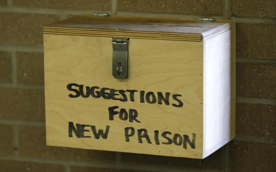 In this Monday, Nov. 18, 2013 photo, a suggestion box hangs on a wall in the kitchen at the Iowa State Penitentiary in Fort Madison, Iowa. The penitentiary, the oldest in use west of the Mississippi River with a history dating back to 1839, is set to close when a $130 million replacement opens down the road next year. (AP Photo/Charlie Neibergall)