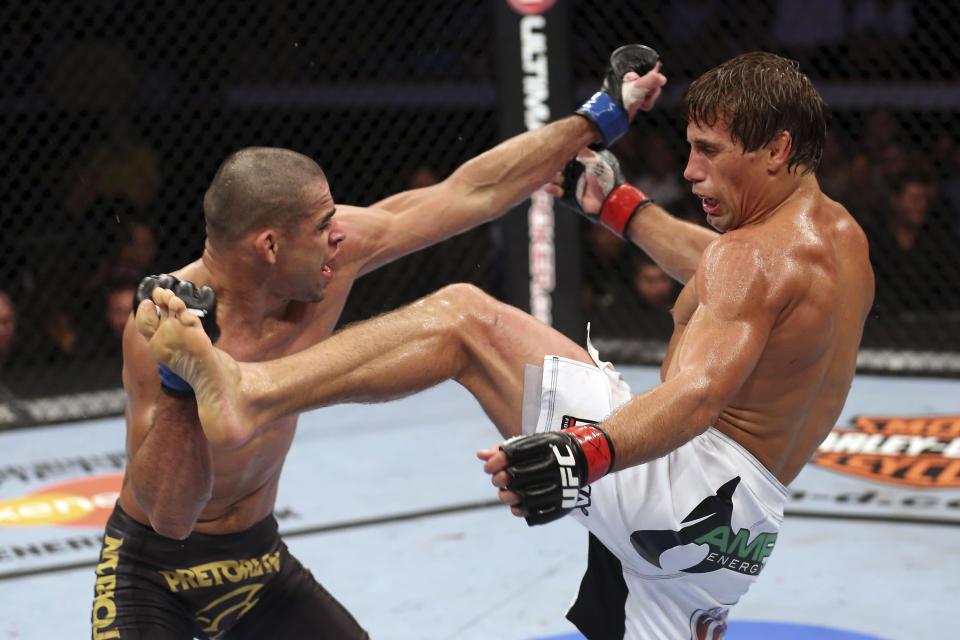 Renan Barao blocks a kick from Urijah Faber during their UFC interim bantamweight championship bout at UFC 149 inside the Scotiabank Saddledome on July 21, 2012 in Calgary, Alberta, Canada. (Photo by Nick Laham/Zuffa LLC/Zuffa LLC via Getty Images)