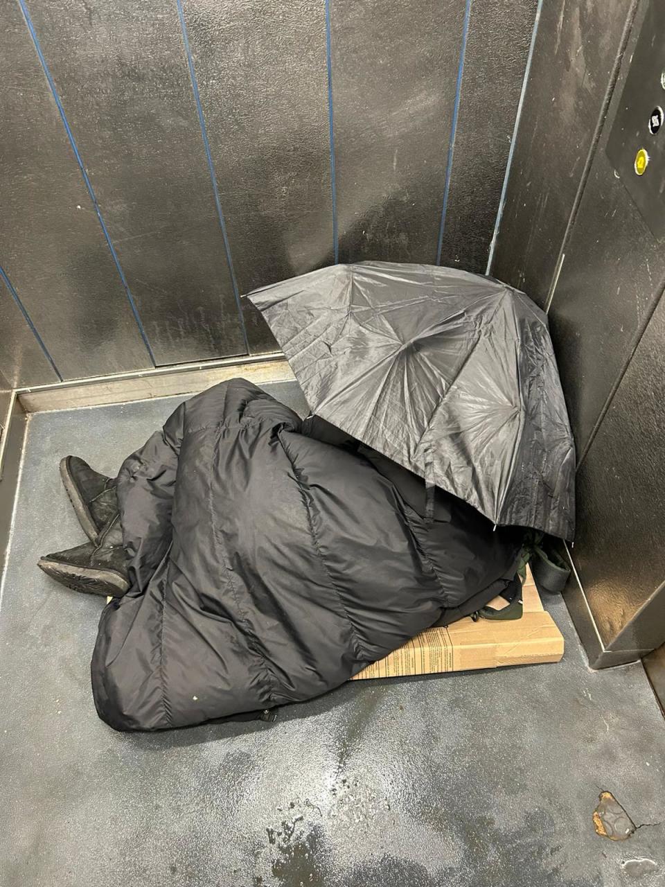 A person sleeping inside one of the lifts at the estate (Supplied)