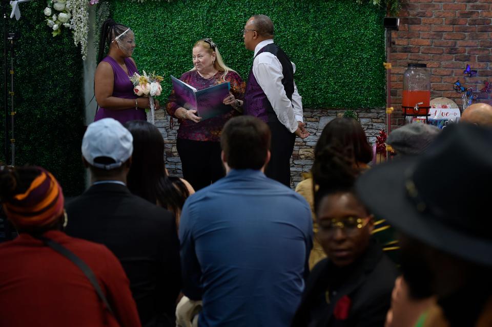 Selecia Young-Jones performs the wedding ceremony for Beatrice and Gary Savage at the Rainbow Wedding Chapel on the ground floor of the Forsyth Street side of the parking garage across from the Duval County Courthouse.