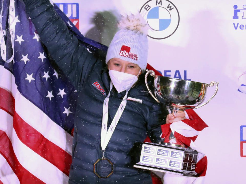 Kaillie Humphries of the United States celebrate after winning with Lolo Jones the two women's bobsleigh race at the Bobsleigh and Skeleton World Championships in Altenberg, Germany, Saturday, Feb. 6, 2021. (AP Photo/Matthias Schrader)