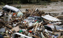 <p>Cars lie among debris on May 30, 2016, after flooding in Braunsbach, in Baden-Wuerttemberg, Germany. (Kai Pfaffenbach/Reuters) </p>