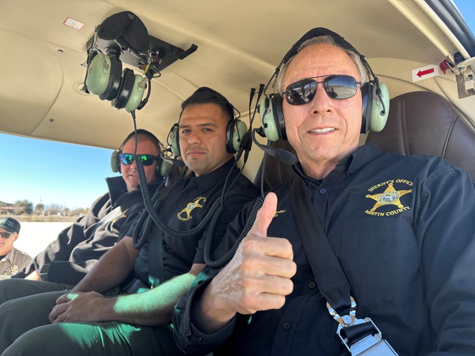 Martin County Sheriff Will Snyder (right), Capt. Ruben Romero (center) and Lt. Gavin Werner in a helicopter above Cochise County, Arizona, where the three visited with Cochise County Sheriff Mark Dannels Feb. 13-16, 2024, to get a detailed briefing on the implications of the open border with Mexico.