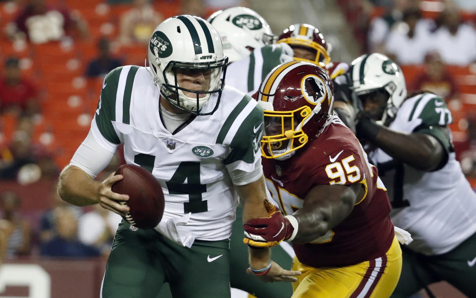 New York Jets quarterback Sam Darnold (14) is sacked by Washington Redskins defensive tackle Da'Ron Payne (95) during the first half of a preseason NFL football game Thursday, Aug. 16, 2018, in Landover, Md. (AP Photo/Alex Brandon)