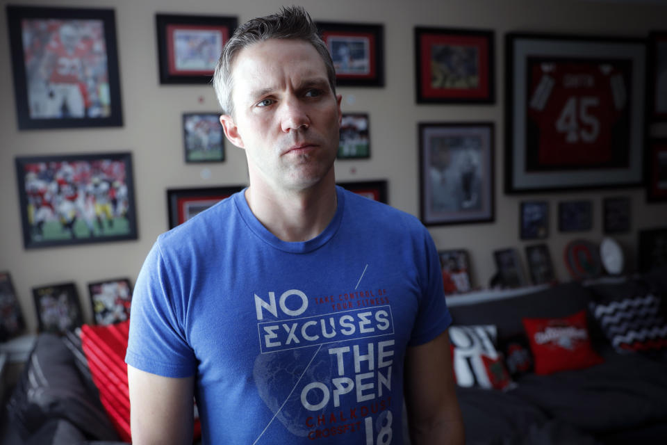 Brian Garrett stands for a portrait at his home, Saturday, May 18, 2019, in Powell. Ohio. Former nursing student Brian Garrett said he worked for a short time at an off-campus clinic Dr. Richard Strauss opened after he was ousted at Ohio State in the late 1990s. But Garrett quit after witnessing abuse by Strauss and then experiencing it himself. (AP Photo/John Minchillo)