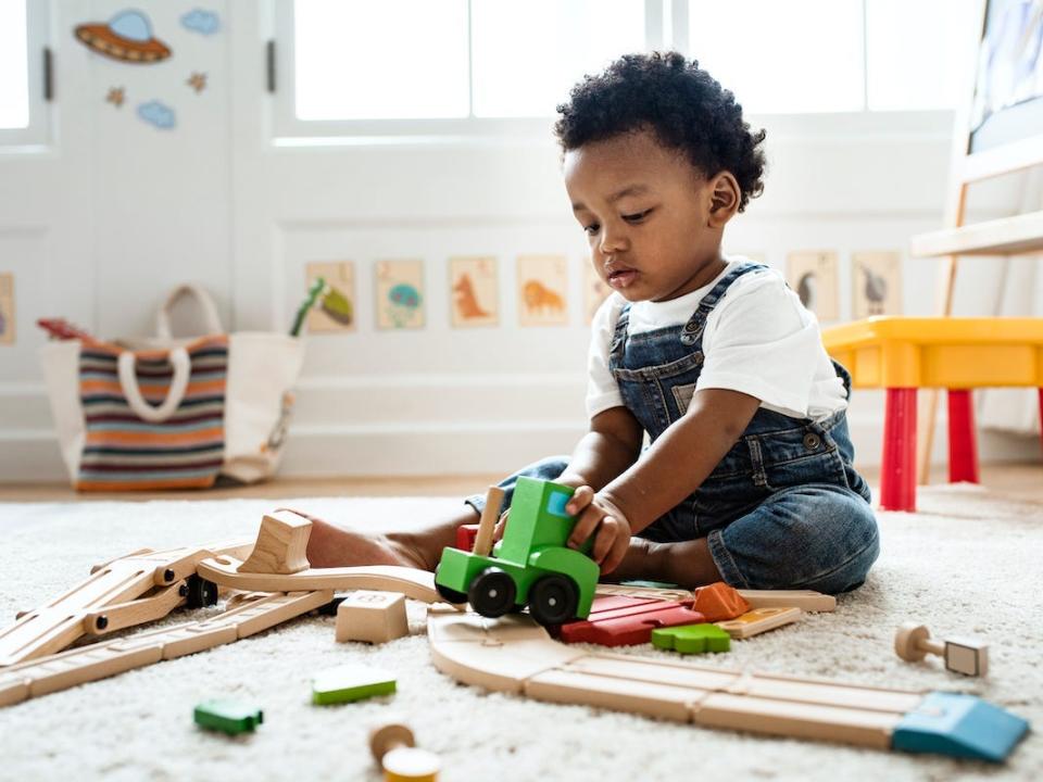 baby plays with toys