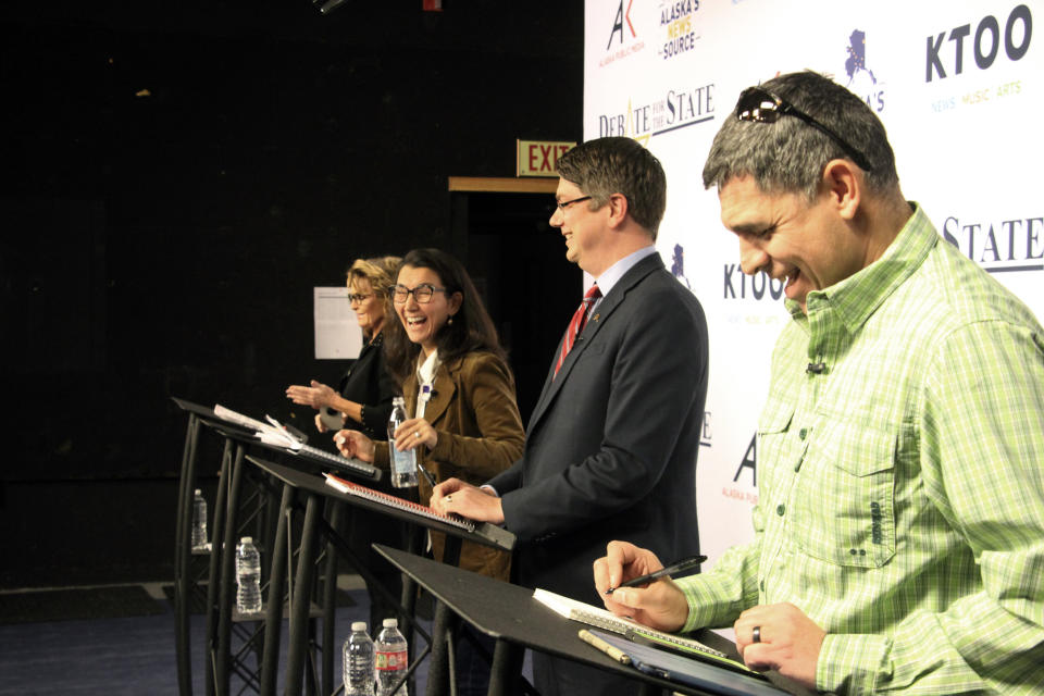 Candidates for Alaska's sole U.S. House seat share a laugh before a debate Wednesday, Oct. 26, 2022, in Anchorage, Alaska. From left are Republican Sarah Palin, U.S. Rep. Mary Peltola, a Democrat; Republican Nick Begich, and Chris Bye, a Libertarian. (AP Photo/Mark Thiessen)