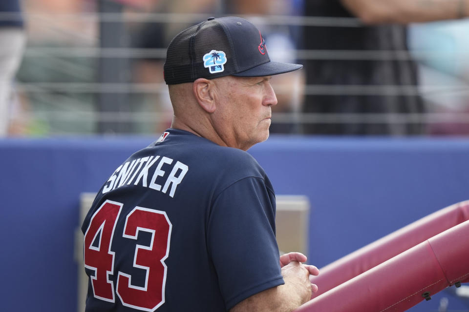 Atlanta Braves manager Brian Snitker watches from the dugout in the second inning of a spring training baseball game against the Philadelphia Phillies in North Port, Fla., Saturday, March 18, 2023. (AP Photo/Gerald Herbert)