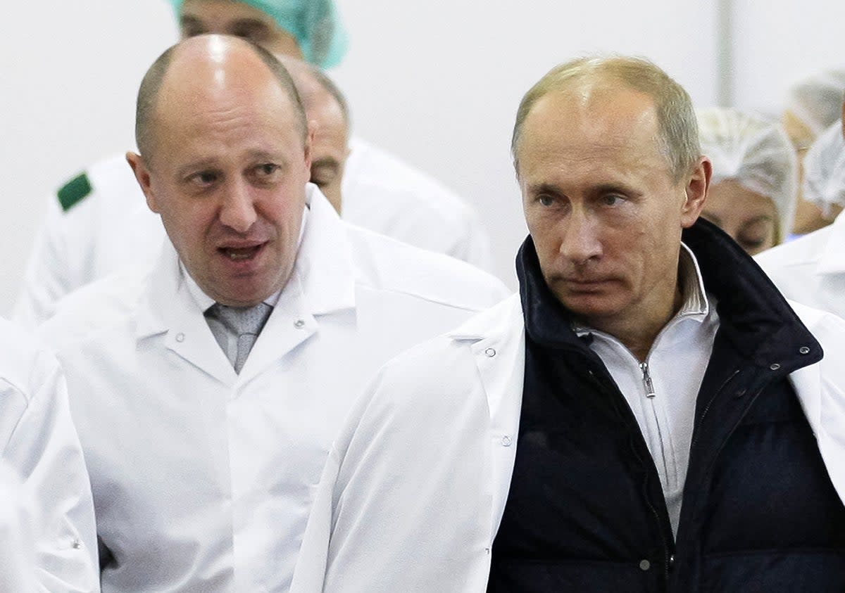Yevgeny Prigozhin, who runs the Wagner Group, with Vladimir Putin.  (AP)