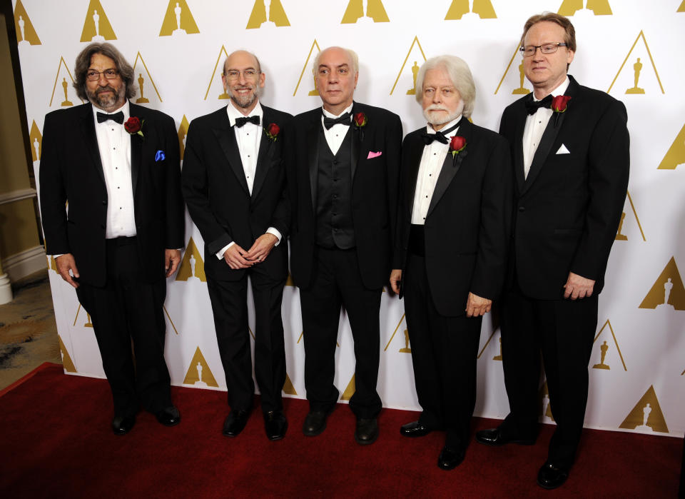 Left to right, Lou Levinson, David Reisner, Joshua Pines, Curtis Clark, ASC, and David Register, developers of the American Society of Cinematographers' Color Decision List technology and recipients of a Technical Achievement Award, pose together at the Academy of Motion Picture Arts and Sciences' annual Scientific and Technical Awards on Saturday, Feb. 15, 2014, in Beverly Hills, Calif. (Photo by Chris Pizzello/Invision/AP)