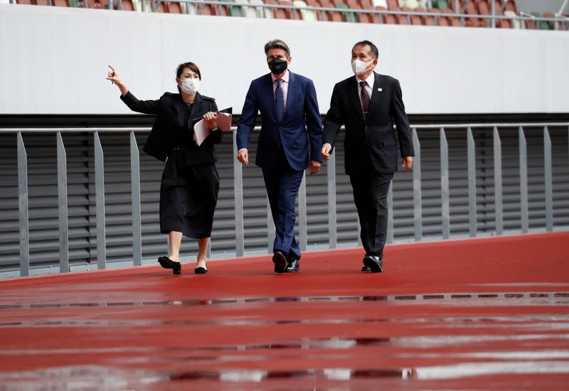 World Athletics President Sebastian Coe wearing a protective face mask inspects at the National Stadium, amid the coronavirus disease (COVID-19) outbreak in Tokyo