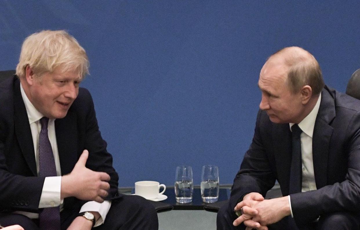 Boris Johnson and Russian president Vladimir Putin pictured at a peace summit on Libya in Berlin in January. A House of Commons committee is set to release a report on alleged Russian interference in UK politics. (ALEXEY NIKOLSKY/Sputnik/AFP via Getty Images)