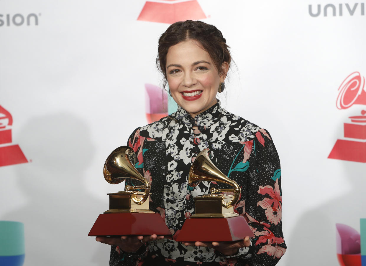 18th Latin Grammy Awards – Photo Room – Las Vegas, Nevada, U.S., 16/11/2017 – Natalia Lafourcade holds the awards for Best Folk Album for "Musas (Un Homenaje Al Folclore Latinoamericano En Manos De Los Macorinos, Vol. 1)" and Best Long Form Music Video for "Musas, El Documental". REUTERS/Steve Marcus