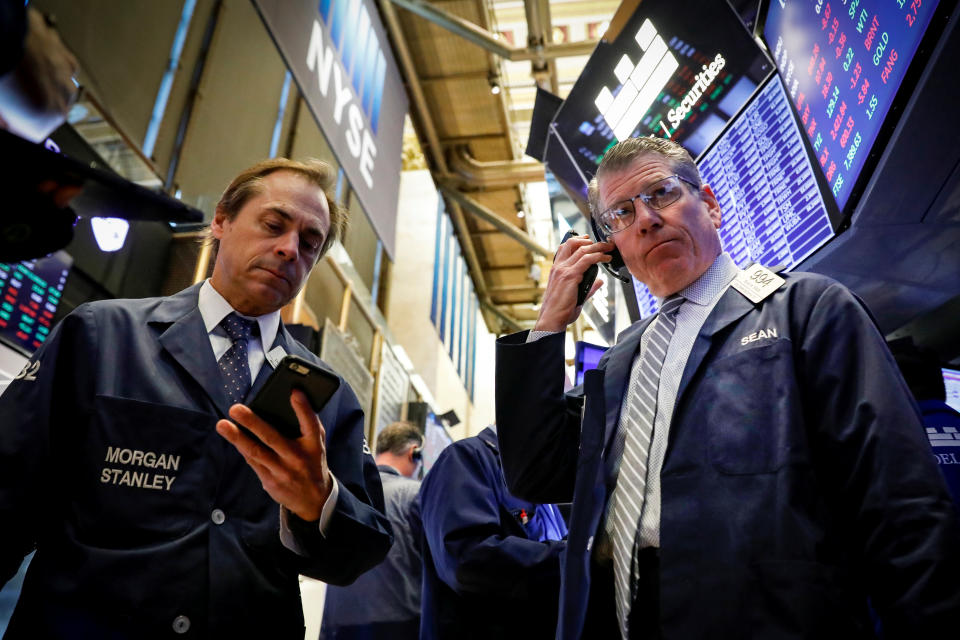 Traders work on the floor at the New York Stock Exchange (NYSE) in New York, U.S., November 6, 2019. REUTERS/Brendan McDermid