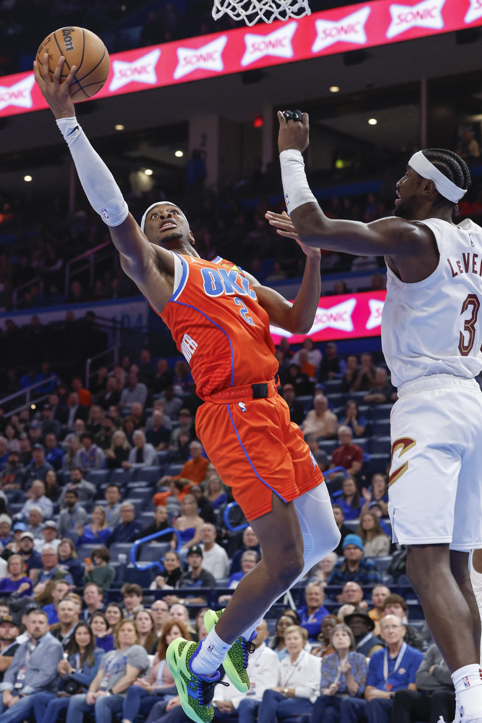 Nov 8, 2023; Oklahoma City, Oklahoma, USA; Oklahoma City Thunder guard Shai Gilgeous-Alexander (2) goes up for a basket against Cleveland Cavaliers guard Caris LeVert (3) during the second half at Paycom Center. Oklahoma City won 128-120. Mandatory Credit: Alonzo Adams-USA TODAY Sports