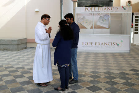 An expat bishop talks with worshippers outside the St. Francis of Assisi Catholic Church in Jebel Ali, as Catholics are awaiting a historical visit by Pope Francis to the United Arab Emirates, in Dubai, UAE January 25, 2019. REUTERS/Ahmed Jadallah