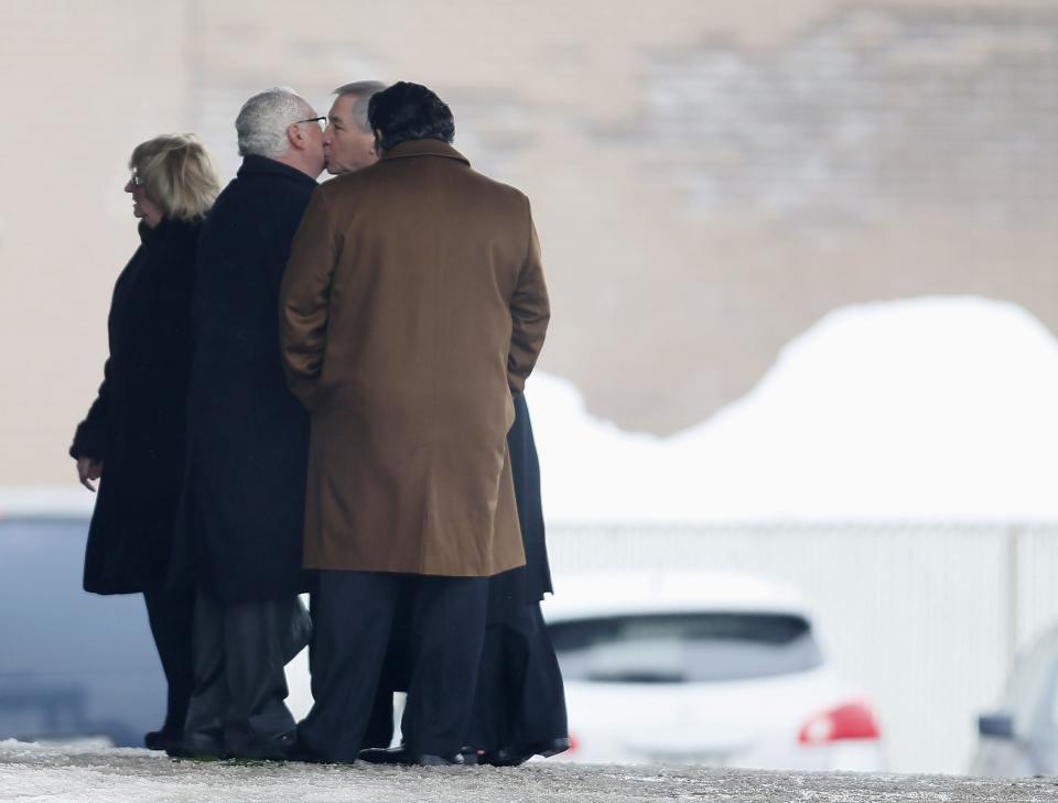 People gather at the funeral home during visitation for Vito Rizzuto in Montreal