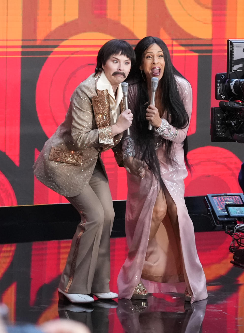 Jenna Bush Hager and Hoda Kotb on stage, dressed as Sonny and Cher.