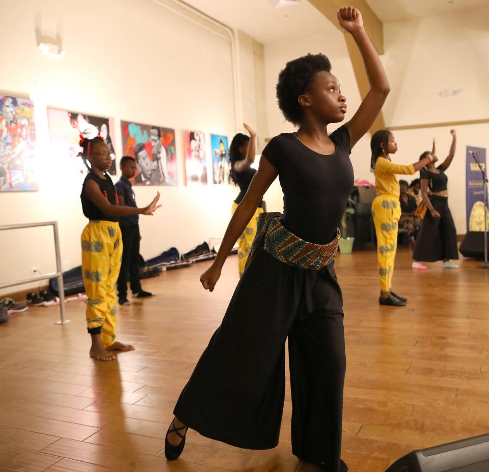 Youth with the Star Center Children's Theater dance and perform during the Juneteenth Breakfast held at the Cotton Club Museum and Cultural Center in Gainesville on June 17.