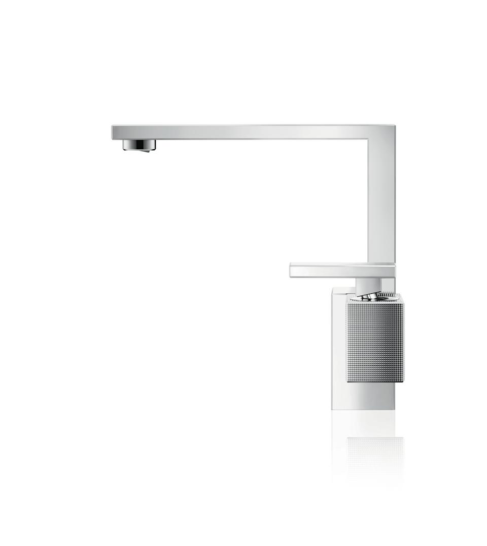 This photo provided by Hansgrohe/AXOR show's a faucet from Axor's new Edge collection. Precise, perfectly smooth edges and detailed fine knurling make Axor's new Edge collection resemble the high-end perfume bottles that were part of the inspiration for Jean Marie Massoud, the collection's famed Italian designer. It will be available in North America in the fall. (Hansgrohe/AXOR via AP)