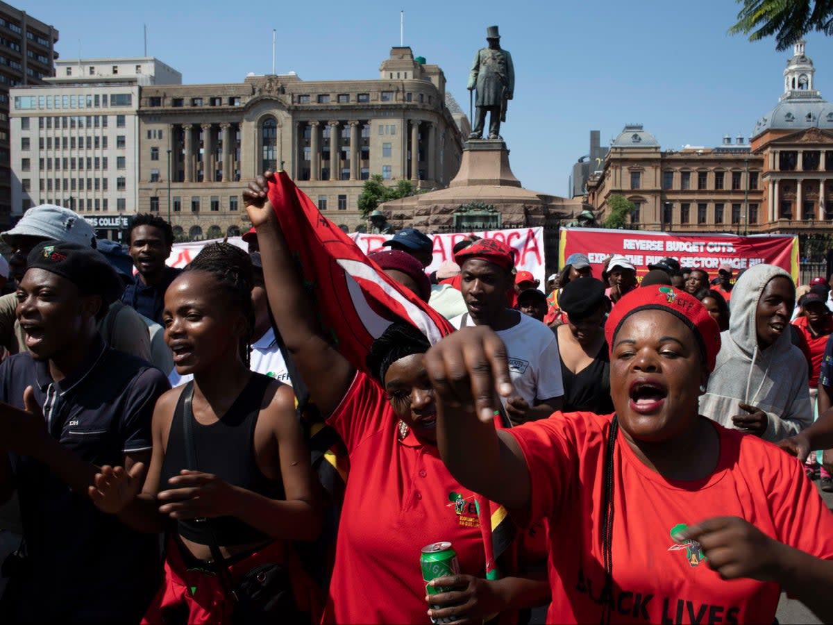 Supporters of leftist political party the Economic Freedom Fighters (EFF) protest in Church Square in Pretoria, South Africa, on 20 March 2023 (Kim Ludbrook/EPA)