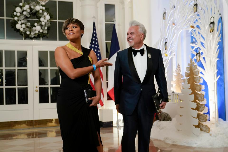 Oscar-winning actress Ariana DeBose and designer Henry R. Muñoz arrive at the state dinner at the White House in Washington on Dec. 1.