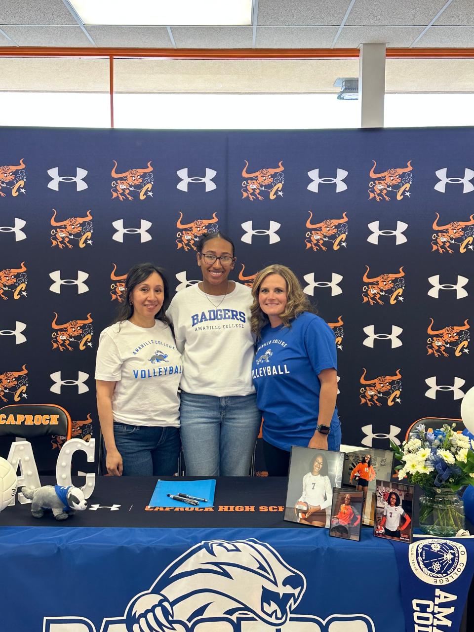 Caprock's Olivia Hurnes (center) signed to play volleyball at Amarillo College on Friday, April 28, 2023 at Caprock High School.