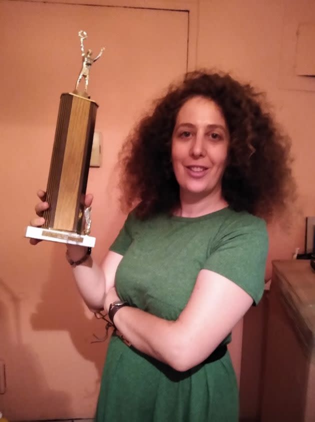 The author in September with her last remaining trophy, which her parents found when moving out of the East 23rd Street apartment. (Photo: Courtesy of Sari Caine)