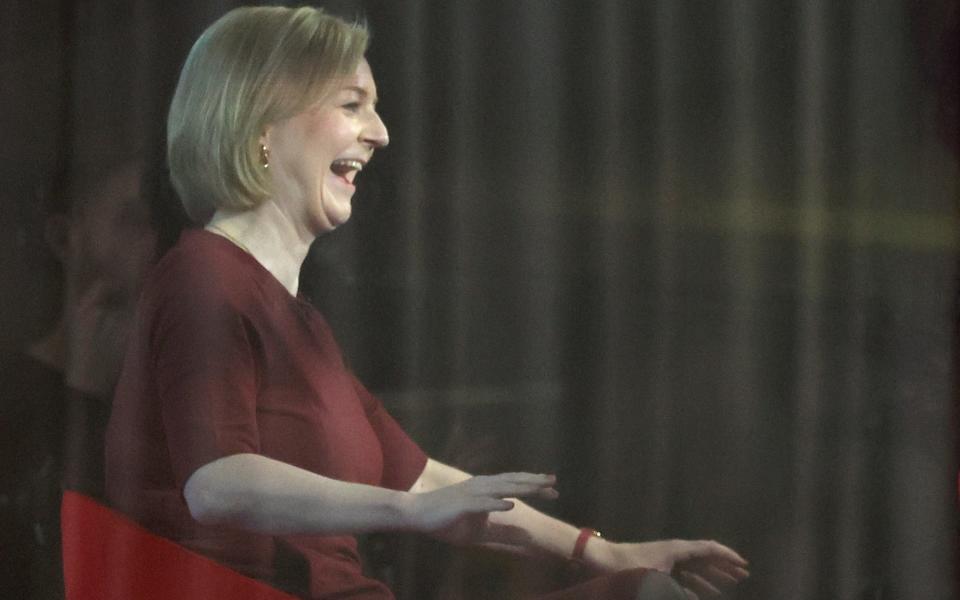 Liz Truss, the Prime Minister, reacts as she speaks at a television studio on Sunday with Laura Kuenssberg - Hannah McKay/Reuters