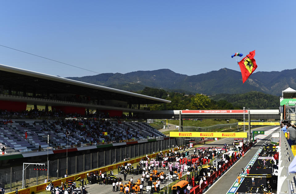 SCARPERIA, ITALY - SEPTEMBER 13: A parachutist flies with a Ferrari flag before the F1 Grand Prix of Tuscany at Mugello Circuit on September 13, 2020 in Scarperia, Italy. (Photo by Rudy Carezzevoli/Getty Images)