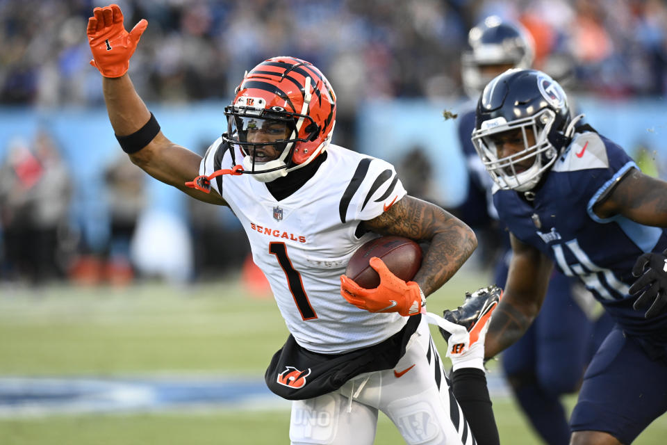 Cincinnati Bengals wide receiver Ja'Marr Chase (1) runs against the Tennessee Titans during the first half of an NFL divisional round playoff football game, Saturday, Jan. 22, 2022, in Nashville, Tenn. (AP Photo/Mark Zaleski)