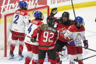 Canada's Danielle Serdachny (92) celebrates her goal against Czechia with teammate Julia Gosling (88) during the first period of a hockey match at the IIHF Women's World Championships in Utica, N.Y., Sunday, April 7, 2024.(Christinne Muschi/The Canadian Press via AP)