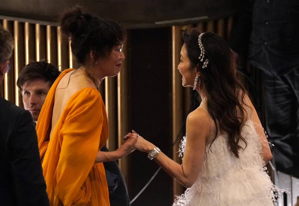 Sandra Oh, left, and Michelle Yeoh are seen in the audience at the Oscars on Sunday, March 12, 2023, at the Dolby Theatre in Los Angeles. (AP Photo/Chris Pizzello)