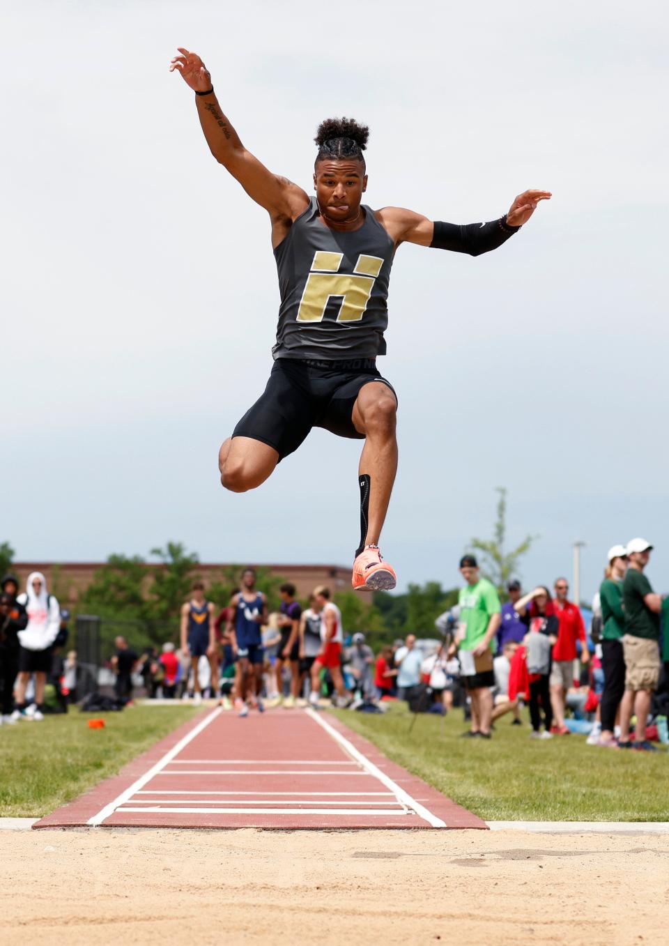 Holt's Kellen Reed jumps in the long jump, Saturday, June 4, 2022, at Rockford High School.