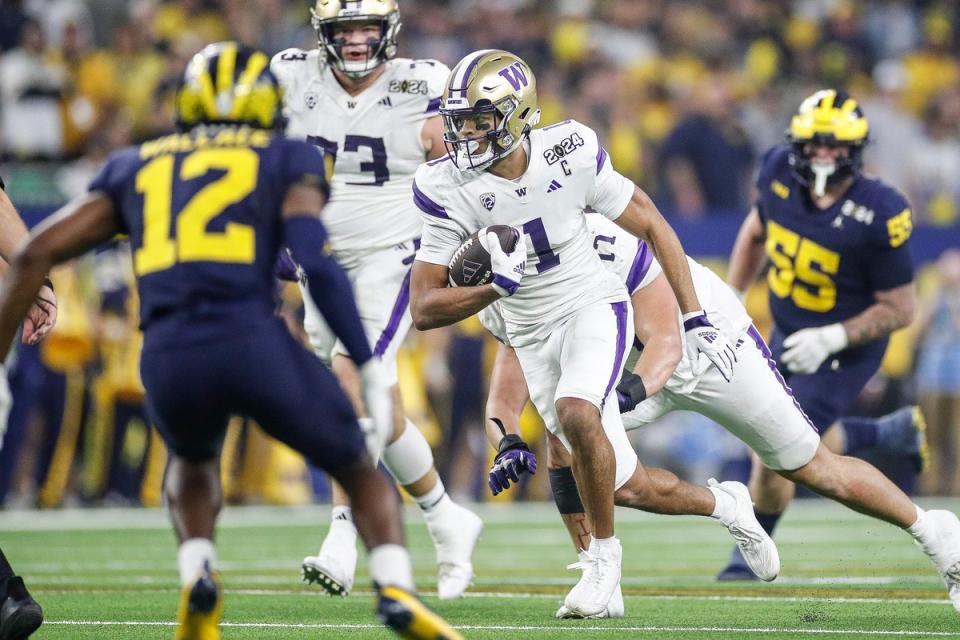 Washington wide receiver Rome Odunze runs against Michigan during the first half of the national championship game at NRG Stadium in Houston, Texas on Monday, Jan. 8, 2024.