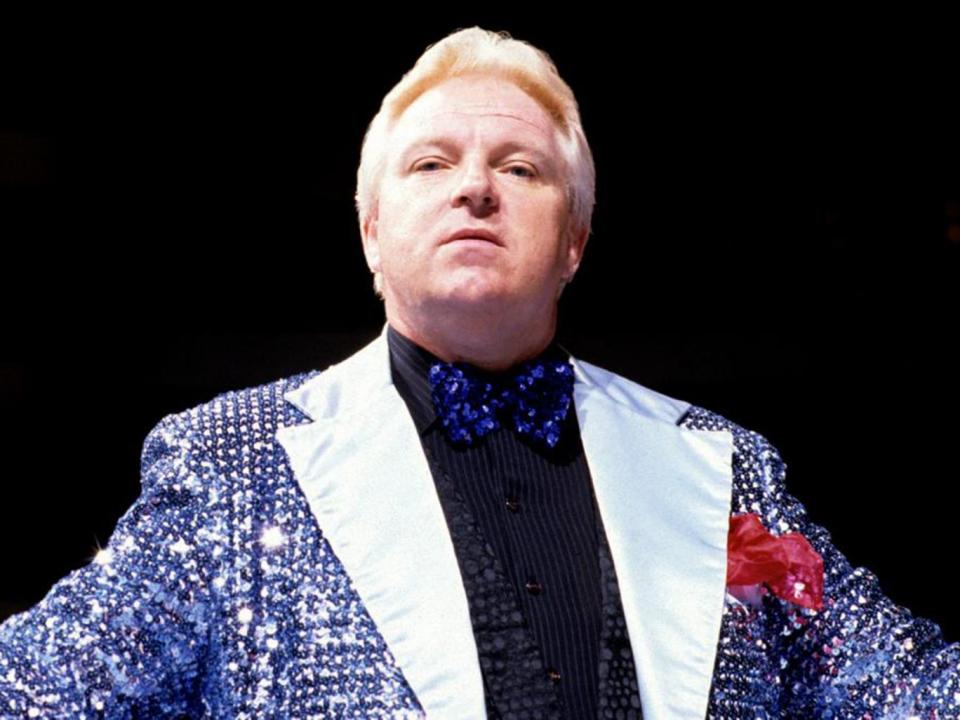 Heenan competed in the WWE along with his roles as a manager and commentator (WWE)