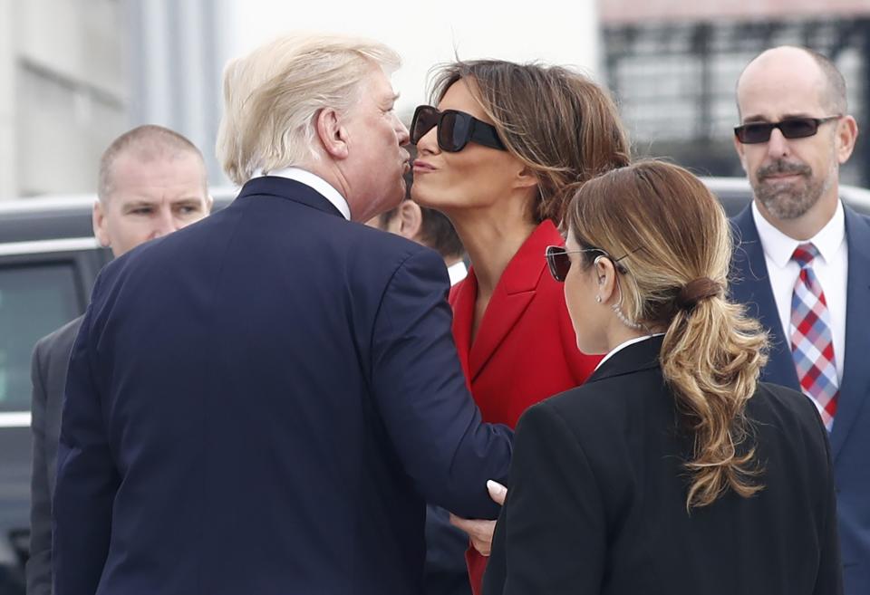 <p>President Donald Trump and First Lady Melania Trump kiss on the tarmac after they arrive on Air Force One at Orly Airport in Paris, Thursday, July 13, 2017. The president and first lady will attend the Bastille Day parade on the Champs Elysees avenue in Paris, France, on Friday, July 14, 2017. The president got into his motorcade vehicle and the first lady went to hers. (Photo: Carolyn Kaster/AP) </p>