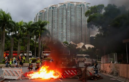 A burning barricade is pictured during a protest near Hong Kong International Airport