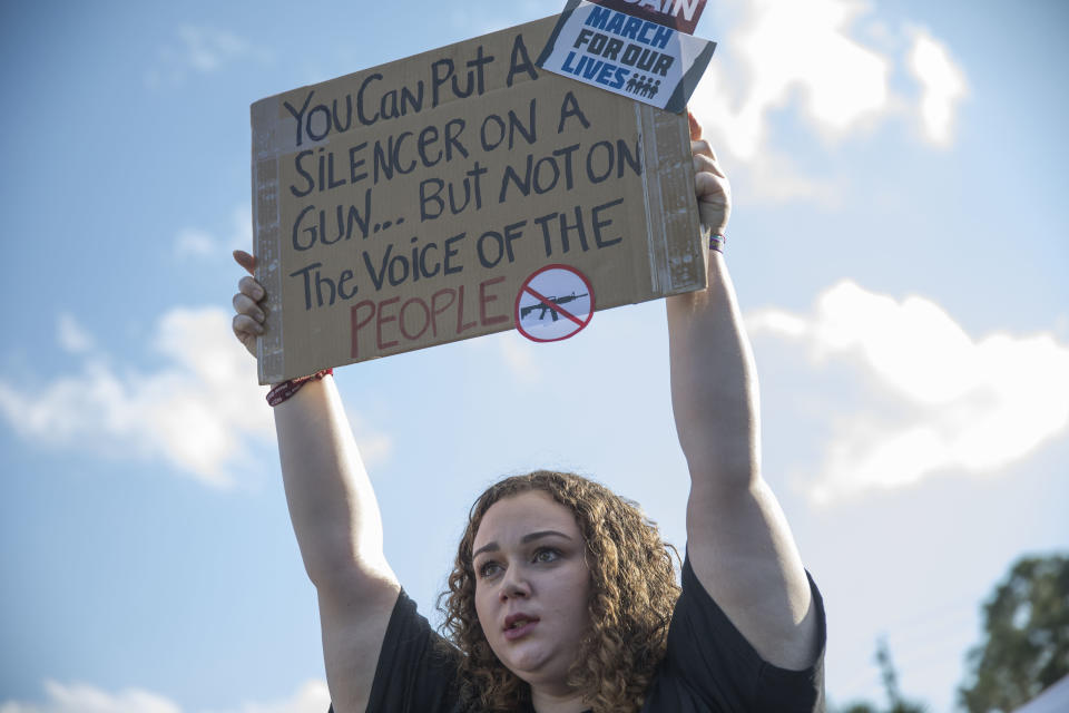 Sophie Phillips holds a sign on March 20 as she attends a rally in Parkland, Florida, for those heading to the March for Our Lives event in Washington, D.C. (Photo: Joe Raedle via Getty Images)