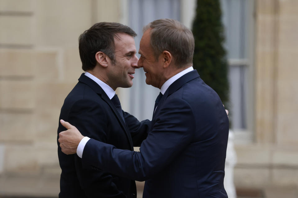 French President Emmanuel Macron, left, welcomes Poland's Prime Minister Tusk, Monday, Feb. 12, 2024 at the Elysee Palace in Paris. Poland's Prime Minister Donald Tusk was traveling to Paris and Berlin in a diplomatic effort to rebuild key alliances as fears grow that former President Donald Trump could return to power in the United States and give Russia a free hand to expand its aggression in Europe. (AP Photo/Aurelien Morissard)