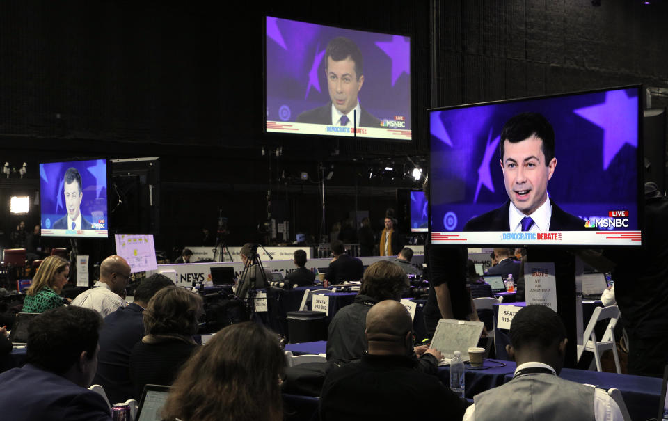 Democratic presidential candidate South Bend Mayor Pete Buttigieg is seen on television monitors in the media filing center during the fifth 2020 campaign debate at the Tyler Perry Studios in Atlanta, Georgia, U.S. November 20, 2019. REUTERS/Christopher Aluka Berry