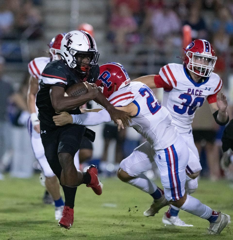 Marquez Jones (4) carries the ball during the Pace vs West Florida football game at West Florida High School in Pensacola on Friday, Sept. 8, 2023.