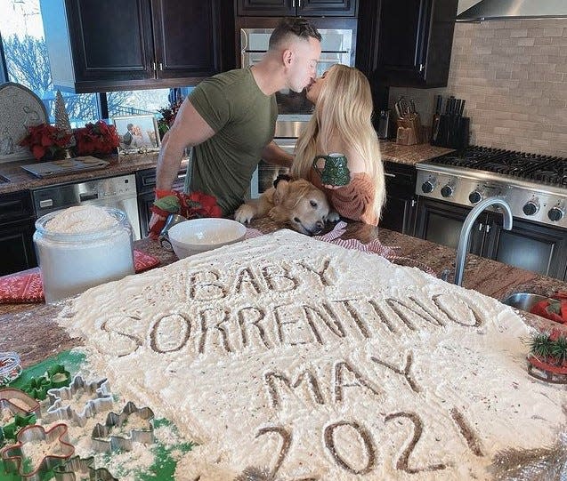 Mike and Lauren Sorrentino with dog Mosey.