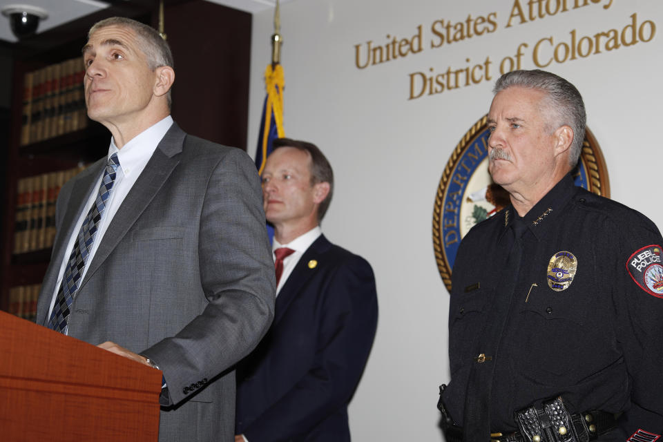 Dean Phillips, FBI special agent in charge, left, makes a point as Jason R. Dunn, U.S. Attorney for the District of Colorado, back left, and Chief Troy Davenport of the Pueblo, Colo., Police Department, look on during a news conference in Denver Monday, Nov. 4, 2019, to annouce the arrest of a man who repeatedly espoused anti-Semitic views in a plot to bomb a historic Colorado synagogue in Pueblo. Richard Holzer, 27, of Pueblo, was charged with a federal hate crime for plotting to blow up the Temple Emmanuel Synagogue in the southern Colorado city.(AP Photo/David Zalubowski)