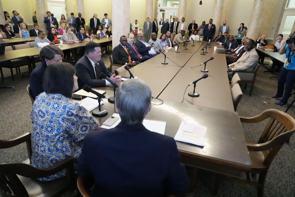 Mississippi House Medicaid Committee Chairman Rep. Missy McGee, R-Hattiesburg, second from right, noting the empty seats on the right, expresses her disappointment that the state Senate conferees did not attend a meeting to discuss their legislative bodies respective legislative plans for the cost of Mississippi Medicaid expansion at a public legislative conference committee meeting held at the Mississippi State Capitol, Thursday, April 25, 2024. House negotiators Rep. Sam Creekmore, R-New Albany, center, and Rep. Joey Hood, R-Ackerman, far left, attended the meeting. (AP Photo/Rogelio V. Solis)