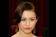 <b>2008</b> <br>Miley Cyrus dons a mature updo at the 80th Annual Academy Awards.