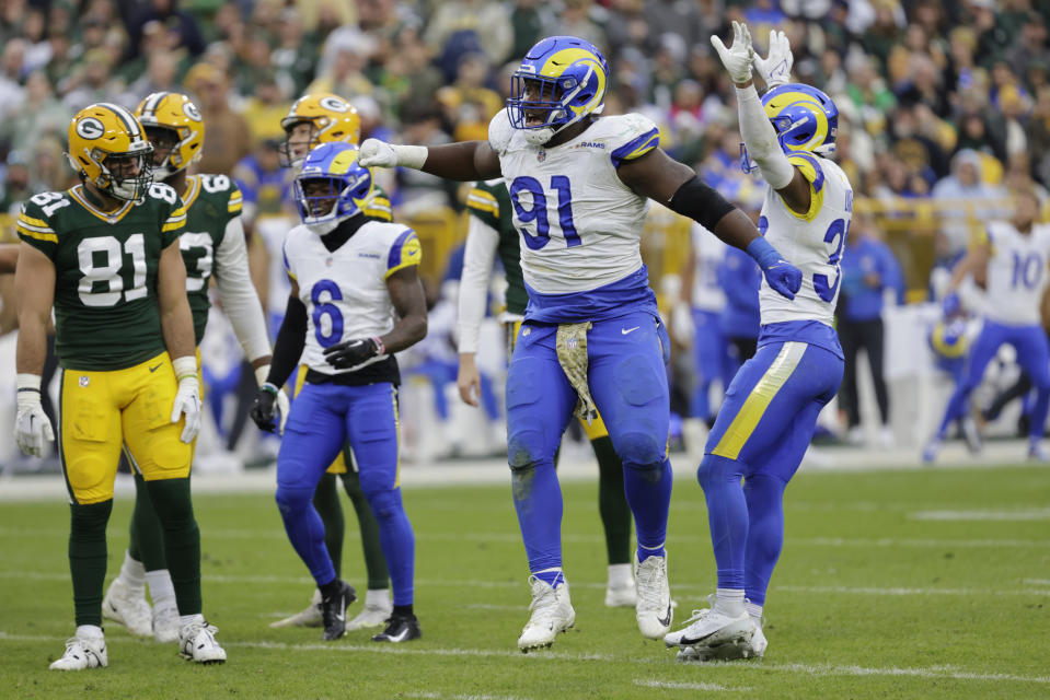 Los Angeles Rams defensive tackle Kobie Turner (91) celebrates after a missed field goal attempt by the Green Bay Packers during the first half of an NFL football game Sunday, Nov. 5, 2023, in Green Bay, Wis. (AP Photo/Mike Roemer)