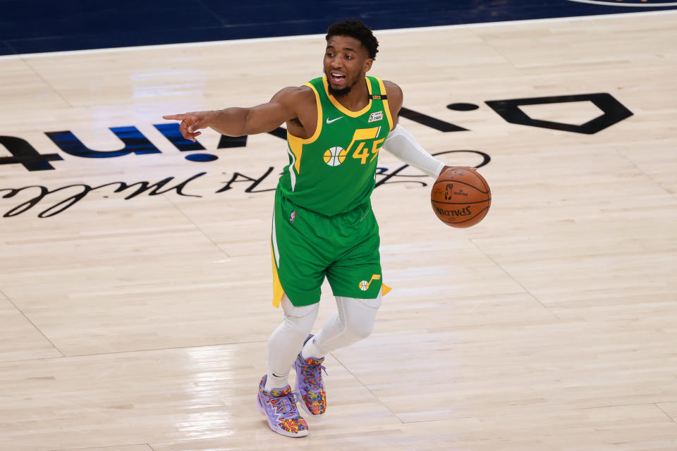 Apr 8, 2021; Salt Lake City, Utah, USA; Utah Jazz guard Donovan Mitchell (45) gestures as he dribbles the ball against the Portland Trail Blazers during the third quarter at Vivint Smart Home Arena. 